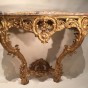 Console dapplique en bois de tilleul doré, Provence époque Louis XV Consoles